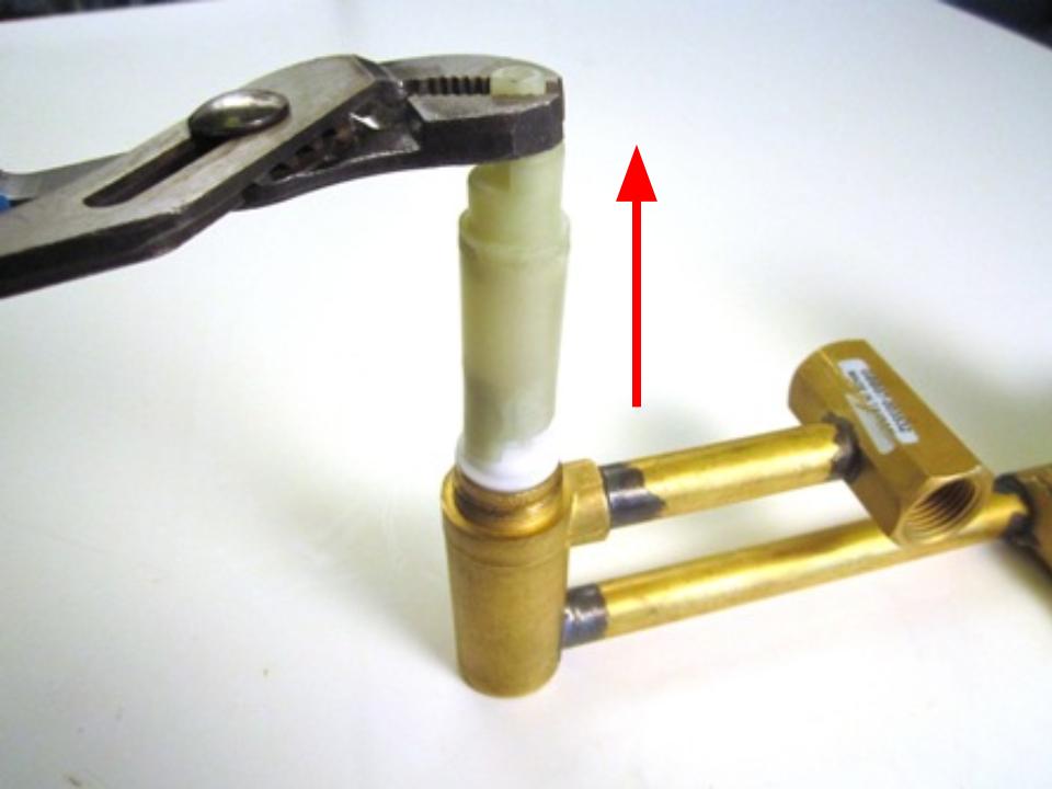 Remove the stem extension by pulling straight out.  The cartridge will likely come off with the extension. 