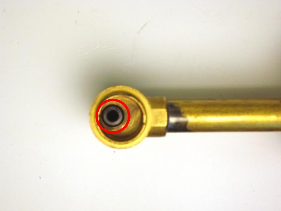 Once the cartridge is removed, look inside the faucet body and locate the seat and spring.