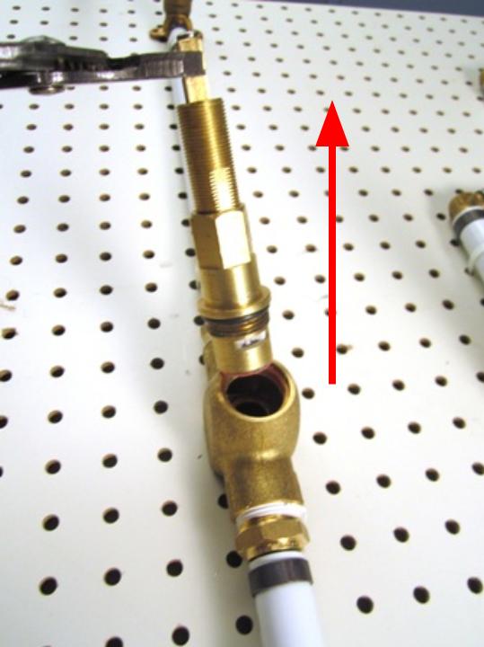 Hold the stem of the cartridge and pull out until the cartridge is completely removed from the faucet body.