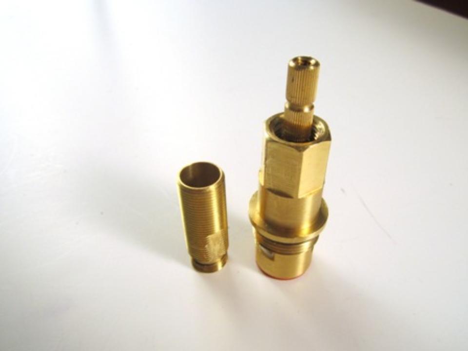 The cartridge and threaded sleeve once they have been seperated.