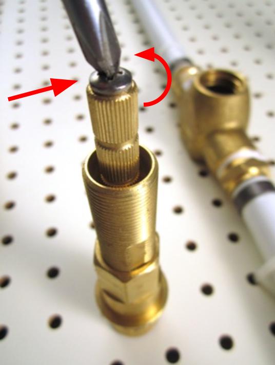Begin by removing the set screw that holds the stem extension in place. Remove the stem extension