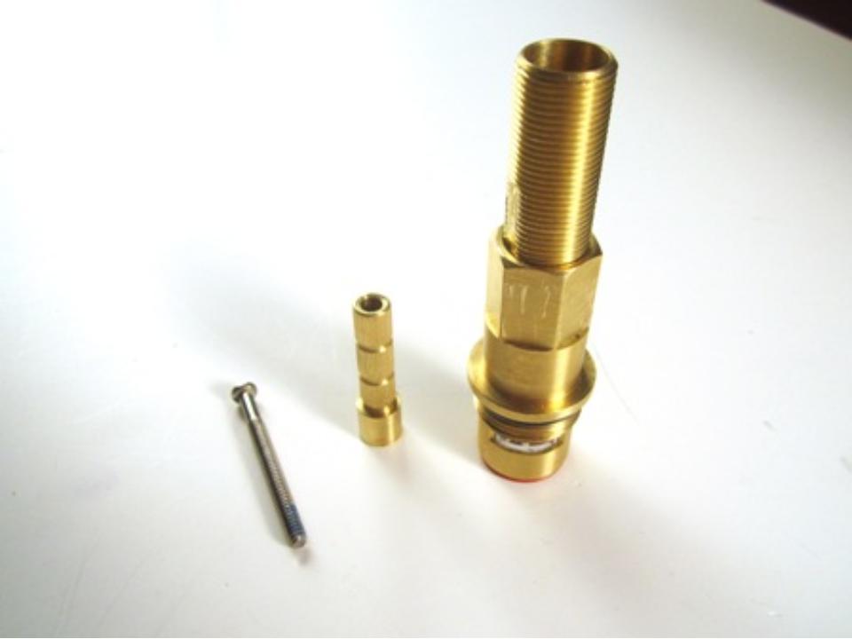 The set screw (left) handle adapter (middle) and the cartridge with threaded sleeve (right).