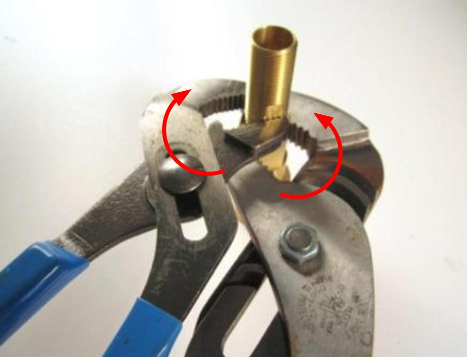  Screw the threaded sleeve onto the cartridge assembly. Use two pairs of adjustable pliers to secure the pieces together.