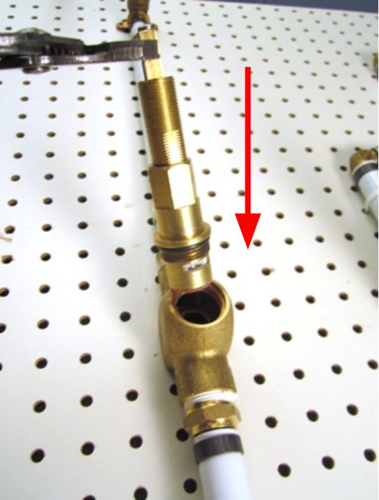 Place the cartridge in the faucet body and using the socket wrench or adjustable pliers, turn clockwise to screw the cartridge into the faucet body. To avoid over-tightening the cartridge, hand tighten the cartridge, and then use the adjustable pliers to apply a quarter turn. Approximately 10-14 lbs of torque are required to properly install the cartridge.