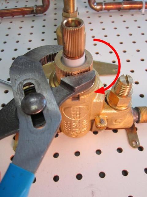 Using a pair of adjustable pliers, re-install the locking nut. In order to avoid over tightening the locking nut, hand tighten the locking nut, and then use the adjustable pliers to apply a quarter turn. Approximately 10-14 lbs of torque are required to properly install the locking nut.