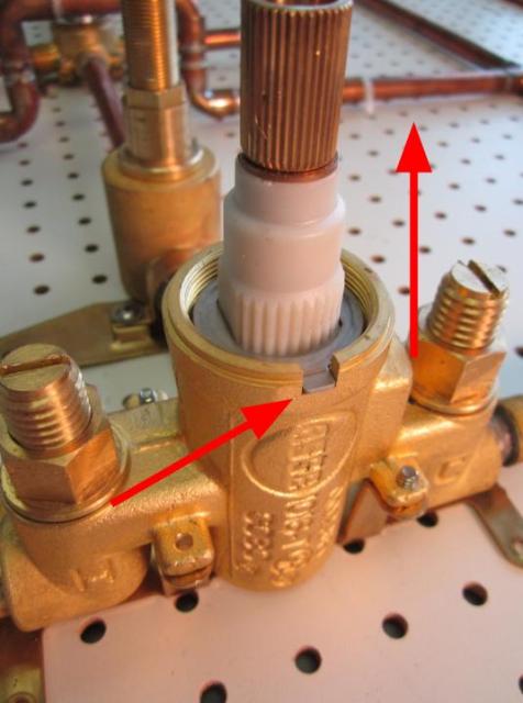 Remove the fixed washer by pulling it up with your fingers.