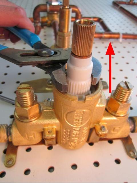 Hold the stem of the cartridge and pull out until the cartridge is completely removed from the faucet body.