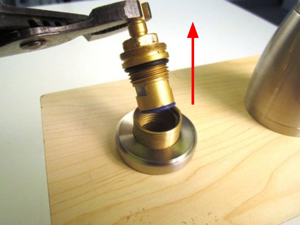 Hold the stem of the cartridge and pull up until the cartridge is completely removed from the faucet body.