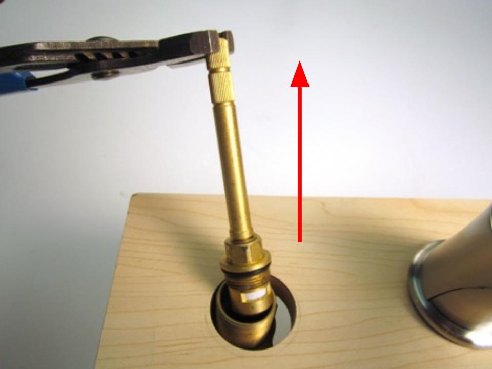 Hold the stem of the cartridge and pull up until the cartridge is completely removed from the faucet body.